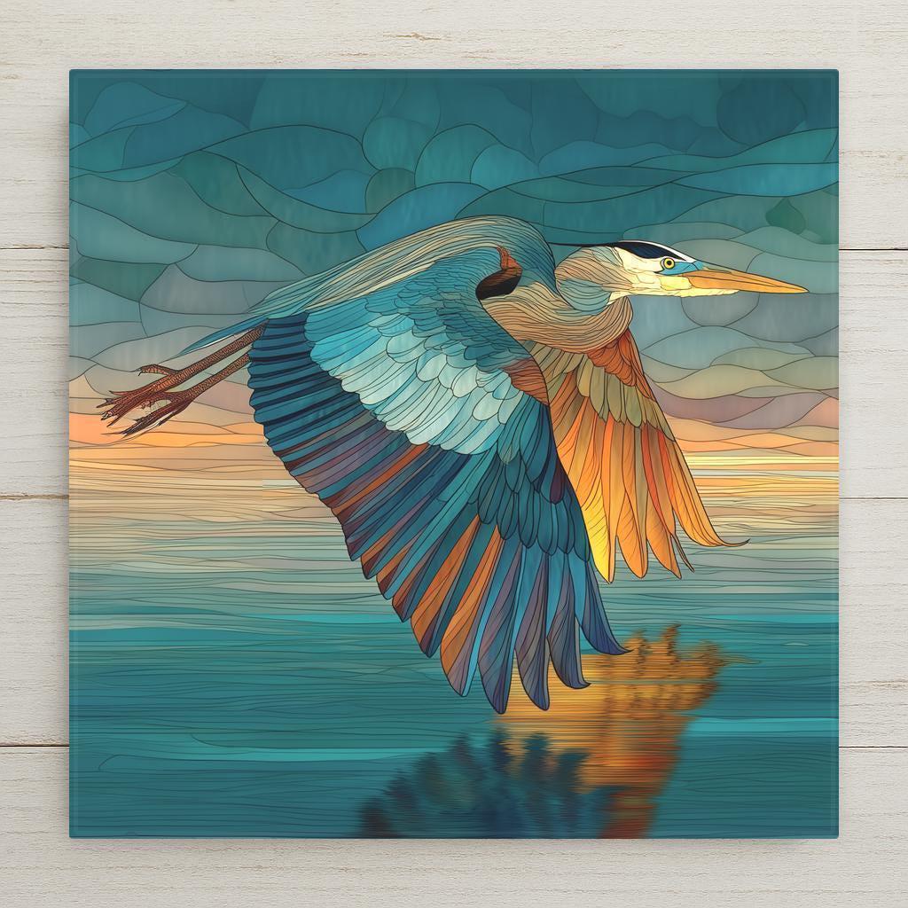 Flying heron stained glass-style ceramic tile featuring teal and amber hues over glowing water. Perfect wall art for home decor. Optional tile wall hanger, tile stand, cork backing, and premium frame available. Permanent print on tile, not real stained glass or mosaic.
