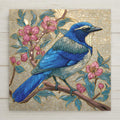 California Scrub Jay ceramic tile art with pink blossoms and stained glass style detail. Perfect for wall art, wall decor, or tabletop display. Permanent print with vivid color. Optional tile wall hanger, easel stand, cork backing, and premium frame available.