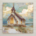 A stained glass–style ceramic tile artwork featuring a white coastal church with glowing windows set among sandy dunes beside the ocean. Soft blue and gold clouds fill the sky, creating a peaceful seaside faith scene. Printed artwork on ceramic tile with optional wall hanger, easel tile stand, cork backing, or premium frame available.