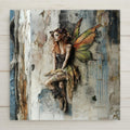 This earthy fairy ceramic tile art features an autumn-winged fairy with a rustic dress and floral crown, resting against a textured wall. With natural tones and a weathered look, it's ideal for fairycore, boho, or woodland decor lovers. A soulful and magical art tile.