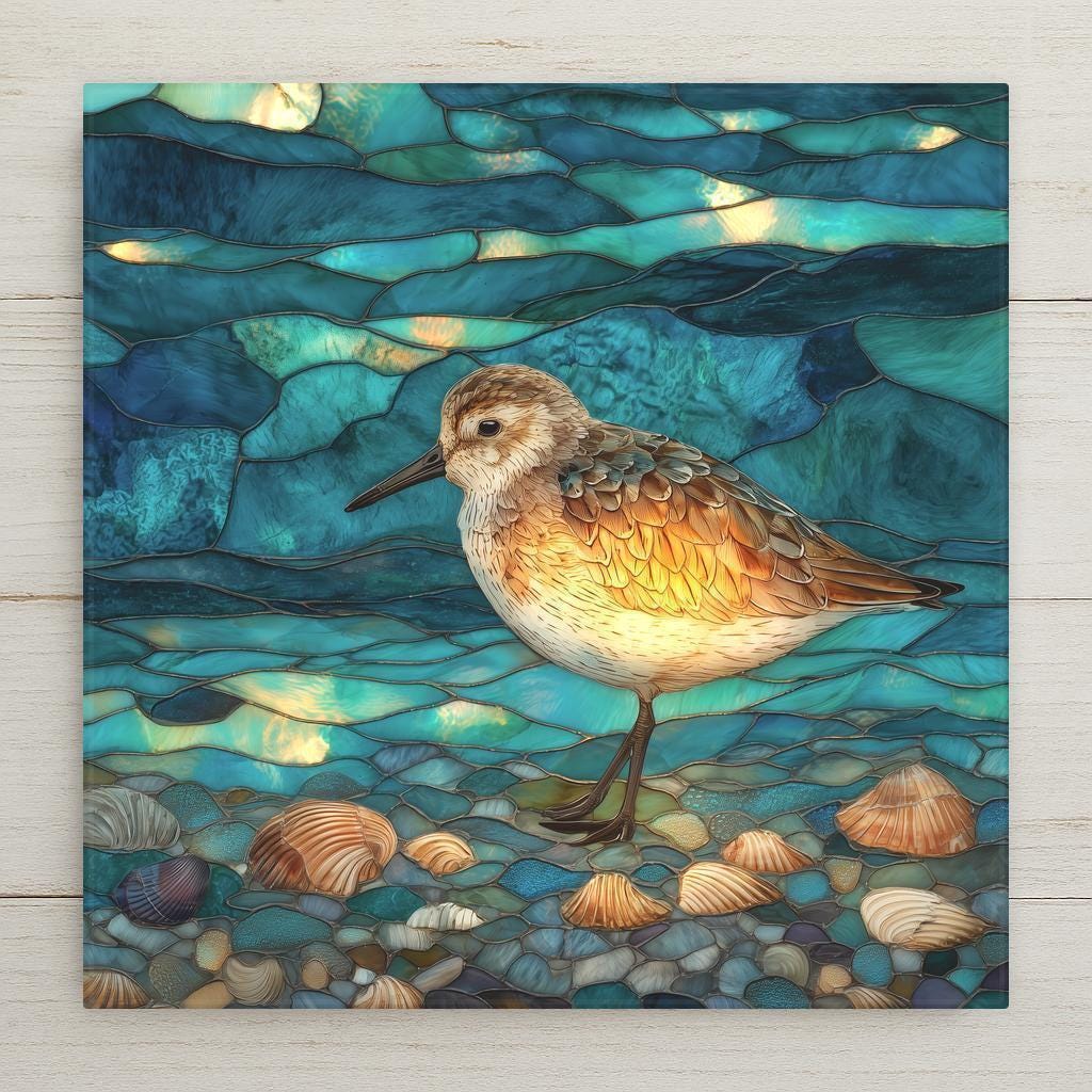 Peaceful sandpiper ceramic tile in a stained-glass style. Bright coastal colors and soft lighting make it perfect for beach décor. Ideal for walls, shelves, or displays. Optional tile wall hanger, easel tile stand, cork backing, and premium frame available. Indoor decorative use.