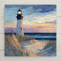 Lighthouse ceramic tile wall art featuring a stained glass-style coastal scene with a lighthouse on sandy dunes beside the ocean. Soft blue, beige, and pastel sky tones create calm beach decor. Printed on ceramic tile with fine detail. Designed for shelf or wall display with optional tile wall hanger, easel tile stand, cork backing, or premium frame.