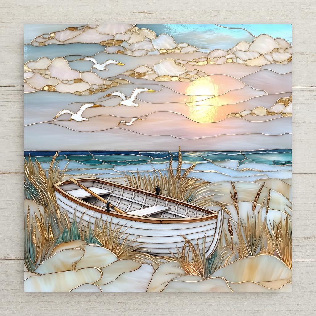 Stained glass style ceramic tile featuring a white rowboat resting in dune grass at sunset. Seagulls fly across layered clouds while golden sun rays reflect over teal ocean waves. Coastal wall art ceramic tile with beach decor, nautical decor, and ocean home decor style.