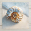 A serene nautilus shell ceramic tile featuring soft beige and blue coastal tones. This high-resolution printed tile captures the calm beauty of the shoreline and is perfect for coastal wall decor, beach house home decor, or minimalist ocean-inspired spaces.