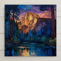 This stained glass-style ceramic tile art features a stunning Yosemite Half Dome reflection, complete with a glowing mountain sunset and a serene river scene. Vibrant and durable, it's ideal as wall art or tabletop décor. Display options include a tile wall hanger, easel stand, or a premium frame for versatile use. Cork backing is an additional option. It's a wonderful gift for nature lovers, hikers, and Yosemite fans.