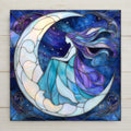 Stained glass style moon goddess ceramic tile with a luminous woman's profile merging with a crescent moon in deep cobalt midnight blue and warm gold tones, mystical celestial home decor.