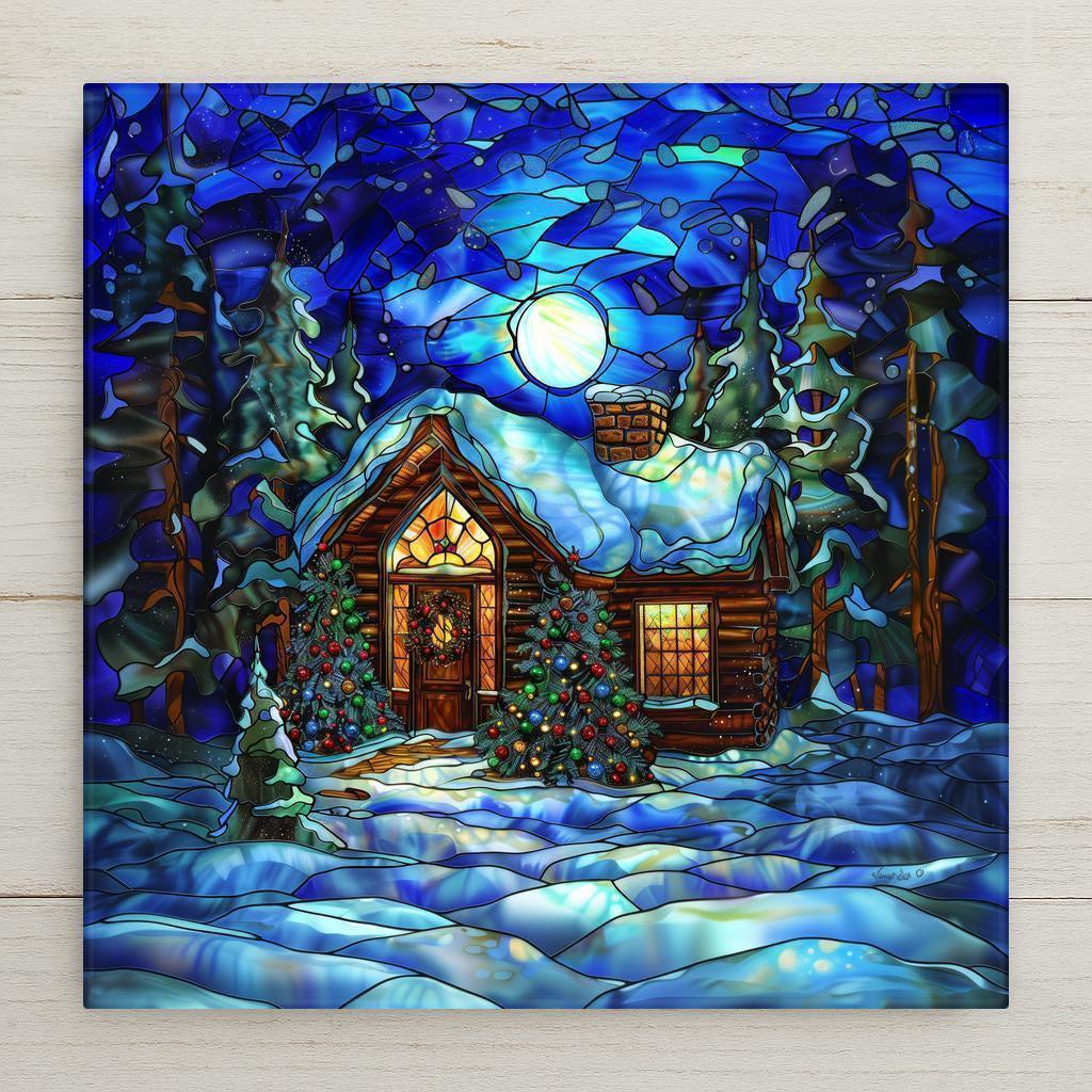 Stained glass–style ceramic tile featuring a glowing Christmas cabin in the forest beneath a moonlit snowy sky home decor. While it may look like stained glass or mosaic, this is a permanent print on tile. Printed with premium inks for lasting vivid color. Optional add-ons include a tile wall hanger, easel tile stand, or cork backing. Perfect for rustic Christmas décor, seasonal wall art, or thoughtful holiday gifts.