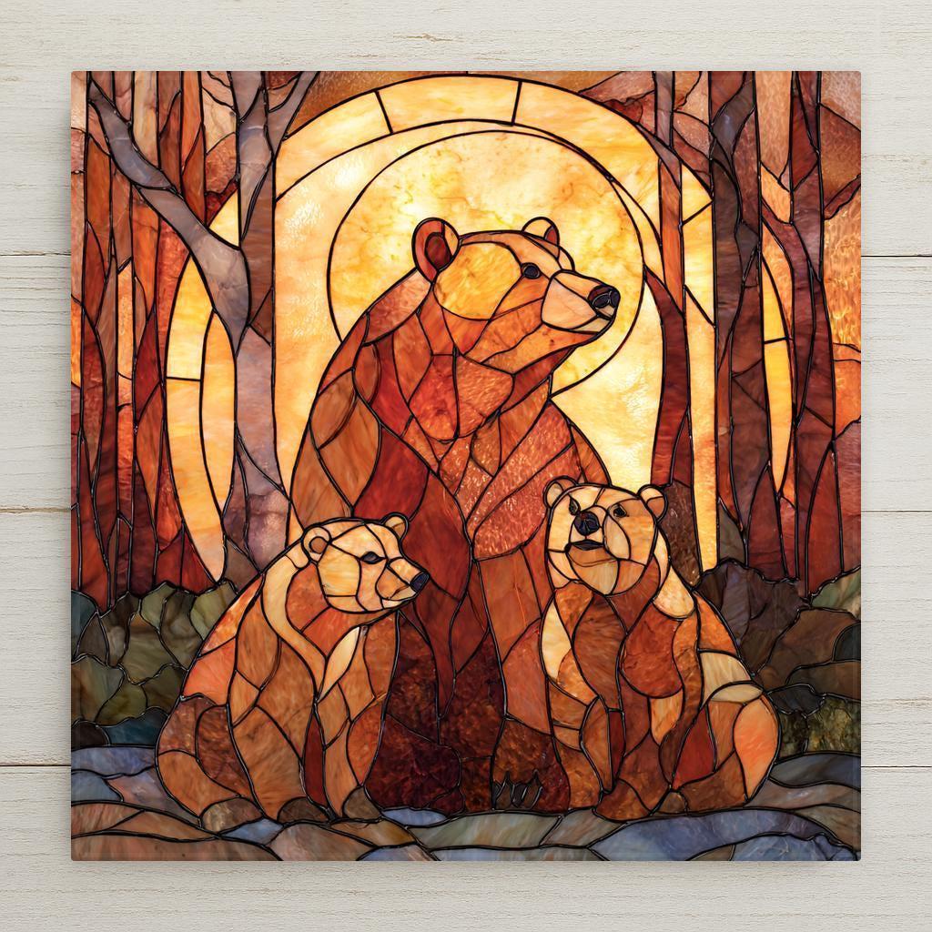 A stained glass-style ceramic tile featuring a mother bear and two cubs in warm amber tones, glowing forest light, and woodland nature scenery.