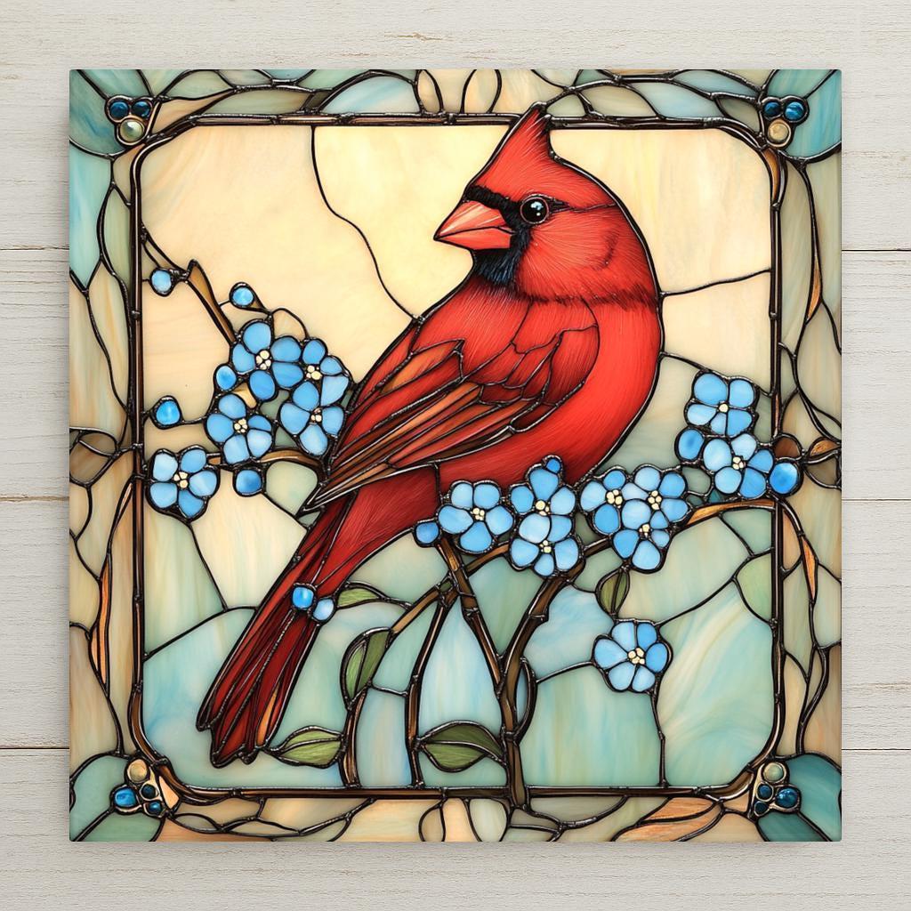 Stained glass style red cardinal ceramic tile perched on a branch surrounded by soft blue forget-me-not flowers against a warm golden background, a timeless memorial and sympathy gift.