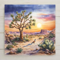 Stained glass style Joshua Tree ceramic tile with iconic silhouette branches against a warm desert sunset sky of gold amber and deep teal, surrounded by desert wildflowers and boulders in jewel-toned stained glass style.