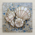 Stained glass style ceramic tile featuring a spiral nautilus shell and conch shell outlined in gold over a textured sea glass and sand background. Soft ivory shells with subtle pink tones rest against scattered blue and white sea glass pieces and water droplets. Coastal wall art ceramic tile with beach decor and nautical home decor feel.