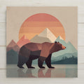 Stained glass style geometric mountain bear ceramic tile with a bold bear silhouette against a dramatic cobalt and teal mountain sunset sky filled with warm amber and gold light, a vivid wilderness cabin decor and bear lover gift.