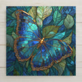 stained glass style blue butterfly with gold filigree wings on teal leaves