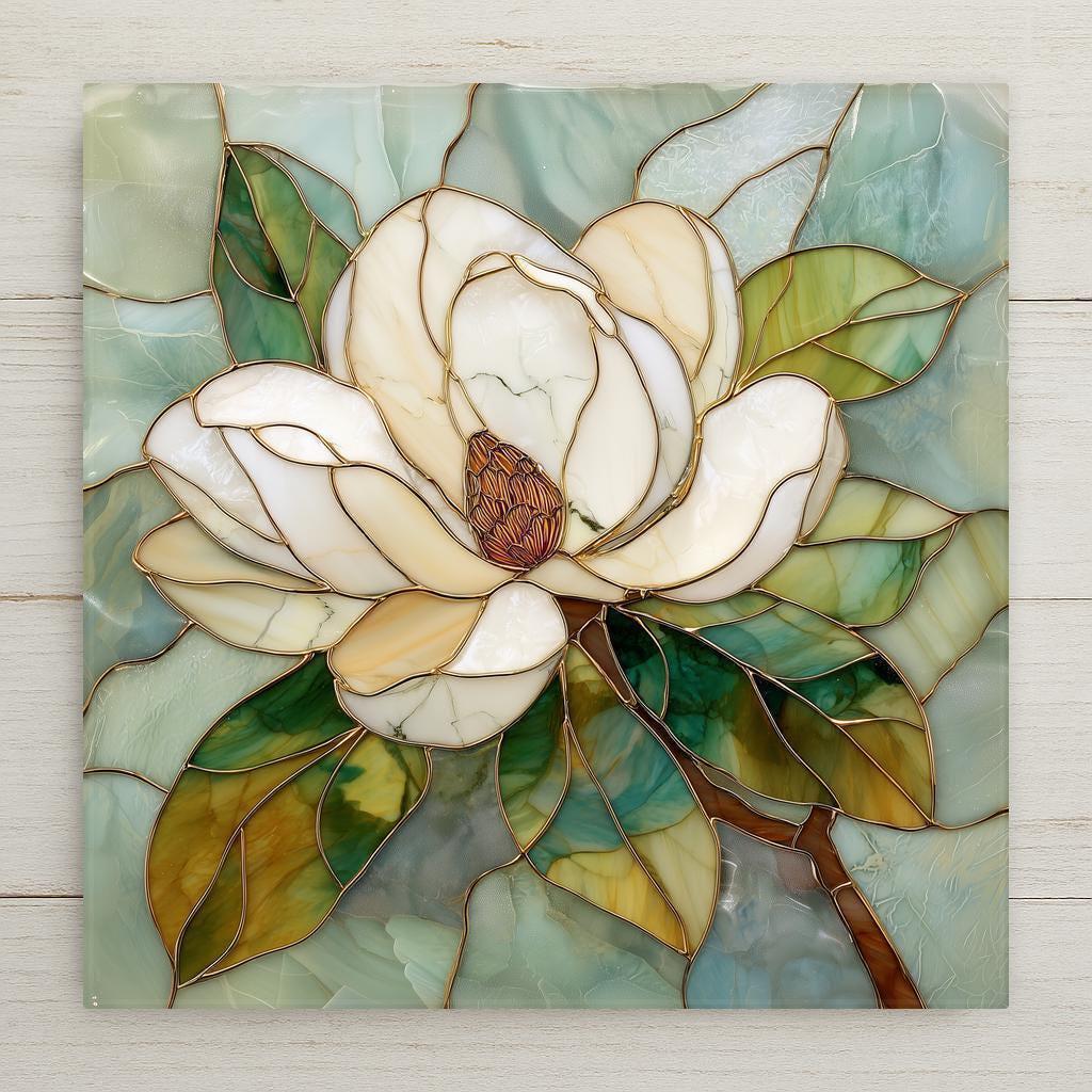 Magnolia ceramic tile wall art featuring a white magnolia flower in a stained glass style with soft green leaves and a calming teal background. Botanical square tile artwork suitable for wall or tabletop display with optional wall hanger, easel stand, cork backing, or premium frame.
