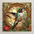 May include: A stained glass style hummingbird with green, blue, and brown feathers. The hummingbird is perched on a branch inside a gold frame with a colorful stained glass background.