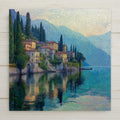 Lake Como Italy ceramic tile wall art featuring a peaceful Italian lakeside village with hillside homes, tall cypress trees, and calm reflective water. Stylized mosaic-inspired European scenery in soft blue, green, and warm pastel tones. This is a flat, permanent print on ceramic tile, not real stained glass or mosaic. Ideal for Mediterranean wall decor, Italian home decor, or travel-inspired art. Optional wall hanger, easel stand, cork backing, and premium frame available.