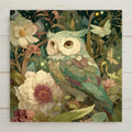 Botanical owl ceramic tile wall art featuring a softly colored owl surrounded by flowers, leaves, and glowing accents in a stained glass-inspired woodland style. Nature-inspired owl wall decor printed on ceramic tile with layered detail and calming green tones. Optional tile wall hanger, easel tile stand, cork backing, or premium frame available.