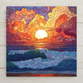 Ocean ceramic tile wall art featuring a stained glass-style sunset with bold clouds in orange, gold, purple, and red above deep blue rolling waves. Glowing sun and dramatic color create expressive coastal decor. Printed on ceramic tile with fine detail. Designed for shelf or wall display with optional tile wall hanger, easel tile stand, cork backing, or premium frame.