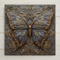 Art Nouveau butterfly ceramic tile wall art featuring an ornate butterfly with sculpted wings, flowing floral scrollwork, and bronze, gold, and blue tones in a stained glass style botanical design.