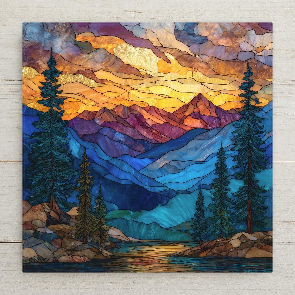 Stained glass–style ceramic tile artwork featuring a Rocky Mountains landscape with layered peaks, evergreen trees, and warm alpine light in rich blue and gold tones.
