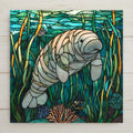 Peaceful manatee ceramic tile with stained glass styling. Ocean decor and Florida wildlife gift for sea life lovers and coastal homes.