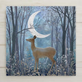 Ceramic tile art featuring a deer under a silver moon in a blue forest. Permanent print on ceramic. Optional hanger, cork backing, or tile stand.