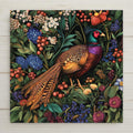 Ceramic art tile of a colorful ring-necked pheasant surrounded by berries, hydrangeas, and roses in a dense decorative botanical pattern — a William Morris style maximalist bird and botanical wall decor.