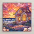 Stained glass style coastal cottage ceramic tile at golden hour with warm amber light glowing in cottage windows against a deep cobalt and teal twilight sky, a garden path and coastal flowers leading to the door, a romantic seaside evening and vacation home gift.