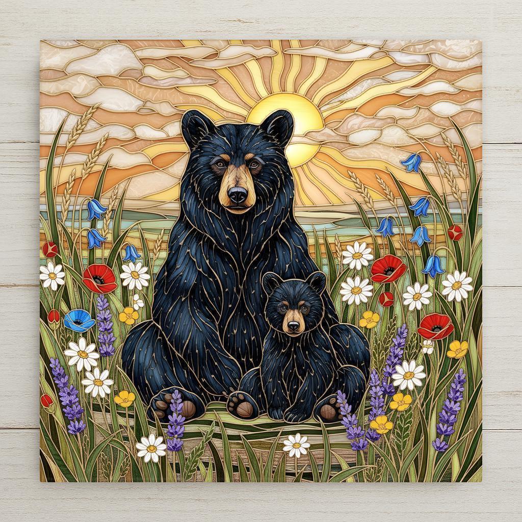 Stained glass style ceramic tile featuring a black bear and cub sitting in a wildflower meadow at sunset. Golden sun rays fill the sky behind them, surrounded by daisies, poppies, bluebells, and tall grasses. Wildlife wall art ceramic tile with rustic cabin decor and woodland home decor feel.