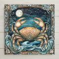 Stained glass style ceramic art tile of a crab under a full moon with the Cancer constellation and ocean waves in teal and blue, celestial coastal zodiac astrology wall decor.