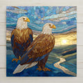 Stained glass style ceramic art tile of two bald eagles perched together against a sunset sky and winding river, in leaded glass panels — a patriotic americana and service-appreciation wall decor.