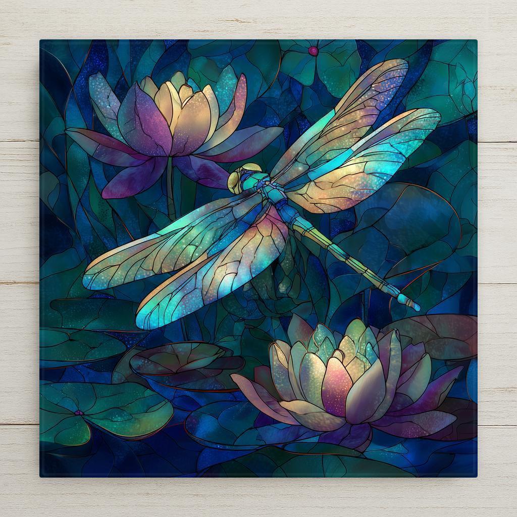 A serene dragonfly hovers above glowing lotus flowers in this stained glass–style ceramic tile artwork. Rich jewel tones and symbolic imagery create a calming, nature-inspired wall decor piece perfect for meditation spaces, bedrooms, or thoughtful gifting. This is a permanent print on ceramic tile with optional display accessories available.