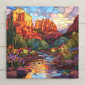 Sedona red rock ceramic tile wall art featuring a stained glass–style desert landscape with glowing canyon cliffs, desert wildflowers, and a reflective creek inspired by Sedona, Arizona. This statement wall art is a permanent high-resolution print on ceramic tile, ideal for Southwest home decor and nature-inspired wall display.