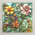 Stained glass style summer garden floral ceramic tile bursting with colorful garden blooms in vivid teal gold rose and violet tones, a luminous cottage garden botanical wall art piece for nature and garden lovers.