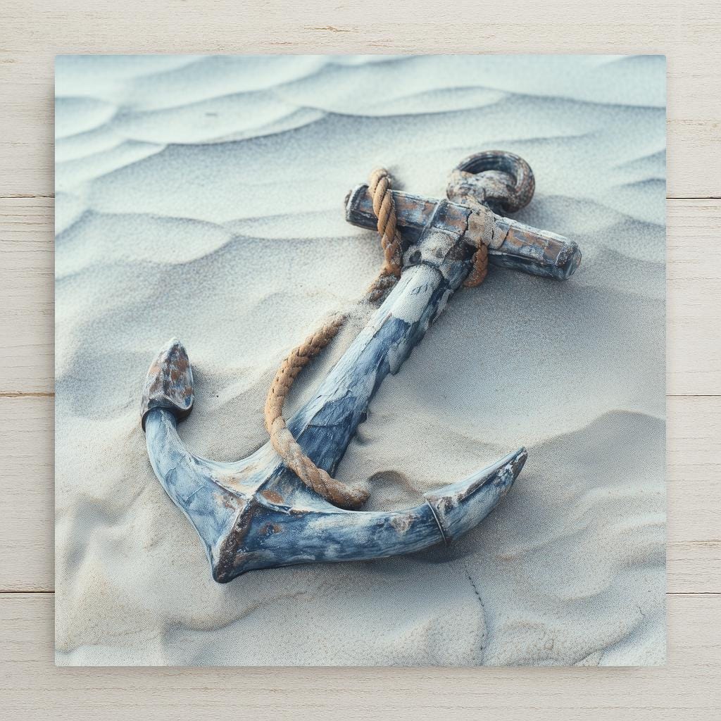Nautical anchor ceramic tile wall art featuring a weathered blue anchor resting in soft beach sand, wrapped with rope in muted coastal tones. Ocean-inspired home decor printed as a permanent, high-resolution ceramic tile with optional wall or tabletop display.