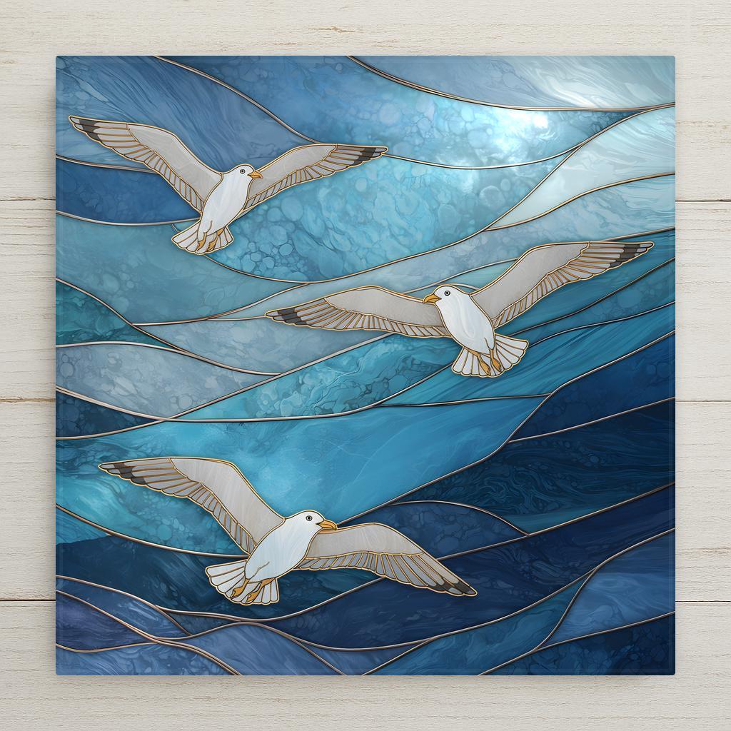 Stained glass style seagull ceramic tile featuring three flying seagulls over flowing blue ocean waves in coastal stained glass design inspired by seaside decor.