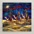 Home decor stained glass–style ceramic tile featuring the Three Wise Men on camels beneath the Star of Bethlehem wall art. While it may look like stained glass or mosaic, this is a permanent print on tile. Printed with premium inks for vivid, lasting color. Optional add-ons include a tile wall hanger, easel tile stand, or cork backing. Perfect for Christmas décor, Nativity wall art, or spiritual holiday gifts.