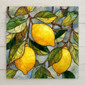 Stained glass style ceramic tile featuring bright yellow lemons on leafy branches with mosaic background.