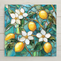 Stained glass style lemon ceramic tile showing glossy yellow lemons and white blossoms with green leaves on a teal glass background with leading, citrus kitchen wall art