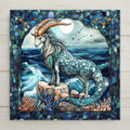 This stained glass-style Capricorn tile features a majestic sea goat on ocean cliffs beneath a moon and stars. A powerful zodiac gift and decor piece.