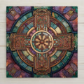 Celtic cross ceramic tile wall art in a stained glass style featuring intricate Irish knotwork and a ringed cross design. This is a permanent print on ceramic tile, not real stained glass or mosaic. Rich jewel tones and medieval detailing make it ideal for spiritual wall decor, Irish home decor, or meaningful gift displays. Optional wall hanger, stand, cork backing, and premium frame available.