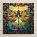 Stained glass-style dragonfly ceramic tile with gold and purple iridescence. Art Nouveau and William Morris inspired. Perfect for spiritual or nature decor. Glossy ceramic finish enhances detail and color. A meaningful gift for dragonfly lovers.