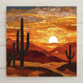 Desert Sunset ceramic tile wall art in glowing amber and gold tones. Stained glass style cactus landscape adds rustic warmth to your wall decor and home decor. Perfect gift for nature lovers, travelers, or Southwestern art collectors. Optional wall hanger, easel stand, cork backing, or premium frame available.