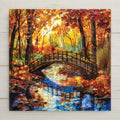 Stained glass–style ceramic tile wall art featuring a rustic autumn bridge and colorful forest reflection. While it may look like stained glass or mosaic, this is a permanent print on tile. Printed with premium inks for bold, lasting color. Optional add-ons include a tile wall hanger, easel tile stand, or cork backing. Perfect for rustic fall décor, seasonal wall art, or thoughtful Thanksgiving gifts.
