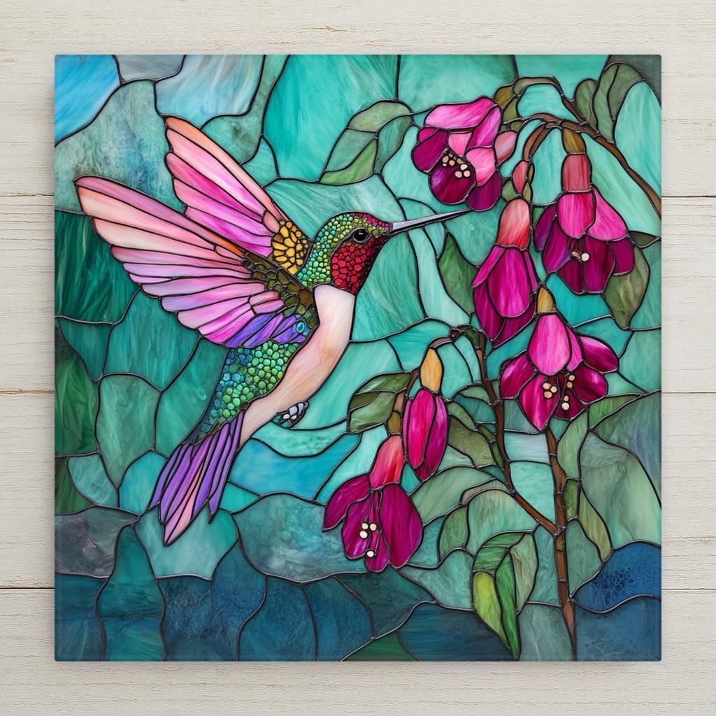 This stained-glass-style ceramic tile features a vivid hummingbird and fuchsia flowers in pink and teal tones. Perfect for spring decor or as a bird lover gift. Optional tile stand, tile wall hanger, or cork backing available.
