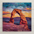Stained glass style Delicate Arch ceramic tile glowing warm amber and gold against a deep cobalt and teal Utah desert sky at sunset, sweeping red rock canyon landscape below, a vivid national park and desert lover wall art gift.