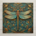 Art Nouveau dragonfly ceramic tile wall art featuring a symmetrical dragonfly with ornate botanical scrollwork in teal, turquoise, and gold stained glass style design.