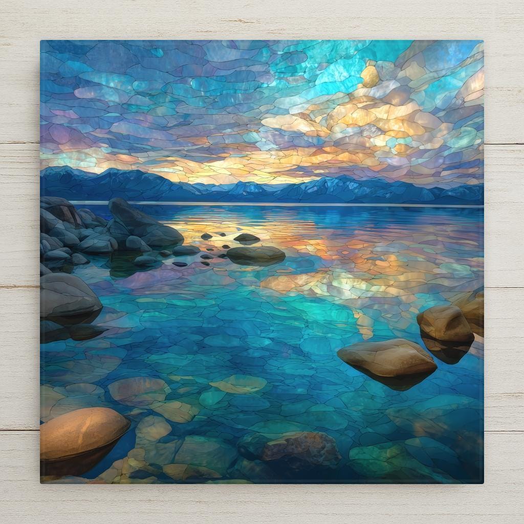 Ceramic tile wall art inspired by Lake Tahoe. This stained glass–style alpine lake scene features crystal-clear turquoise water, smooth shoreline stones, and glowing sunset reflections framed by mountain peaks. A permanent print on tile, not real glass or stone. Ideal for peaceful home decor, mountain lake wall decor, and scenic nature interiors. Optional tile wall hanger, easel tile stand, cork backing, or premium frame available.