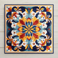 Hand-painted Talavera style ceramic art tile with a symmetrical floral mandala in cobalt blue, gold, red, and terracotta on a cream background, in vibrant Mexican folk art style.