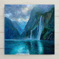 Milford Sound ceramic tile wall art featuring a dramatic fjord with a tall waterfall and deep blue water in Fiordland National Park, New Zealand, shown in a stained glass style mosaic. Square fjord landscape tile artwork suitable for wall or tabletop display with optional wall hanger, easel stand, cork backing, or premium frame.